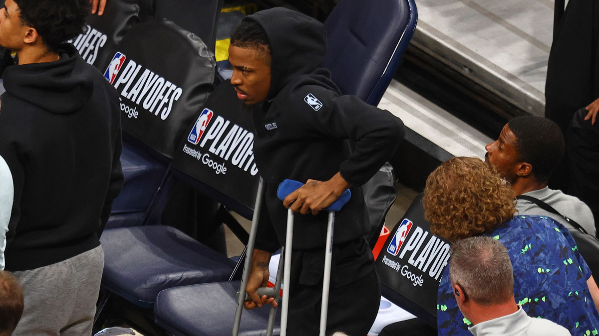 Memphis Grizzlies guard Ja Morant (12) stands by the bench on crutches during the fourth quarter against the Oklahoma City Thunder during game three for the first round of the 2024 NBA Playoffs at FedExForum.