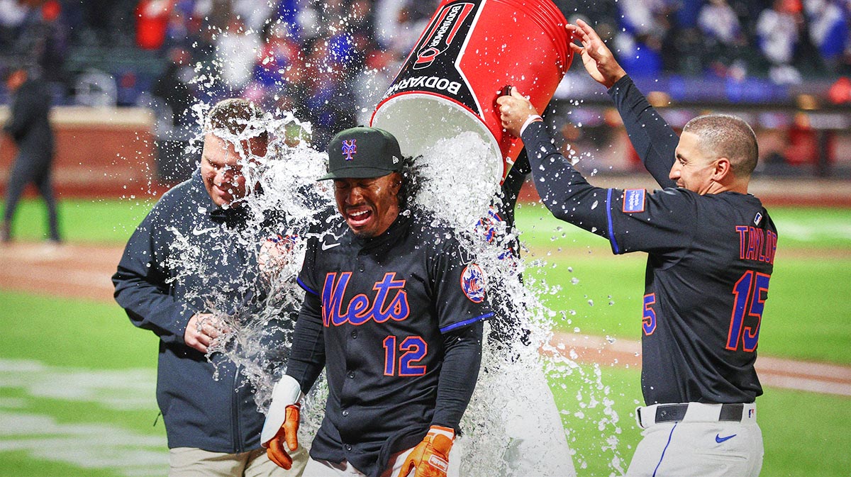 New York Mets shortstop Francisco Lindor (12) is doused with water after hitting a game-winning solo home run in the ninth inning against the St. Louis Cardinals at Citi Field.