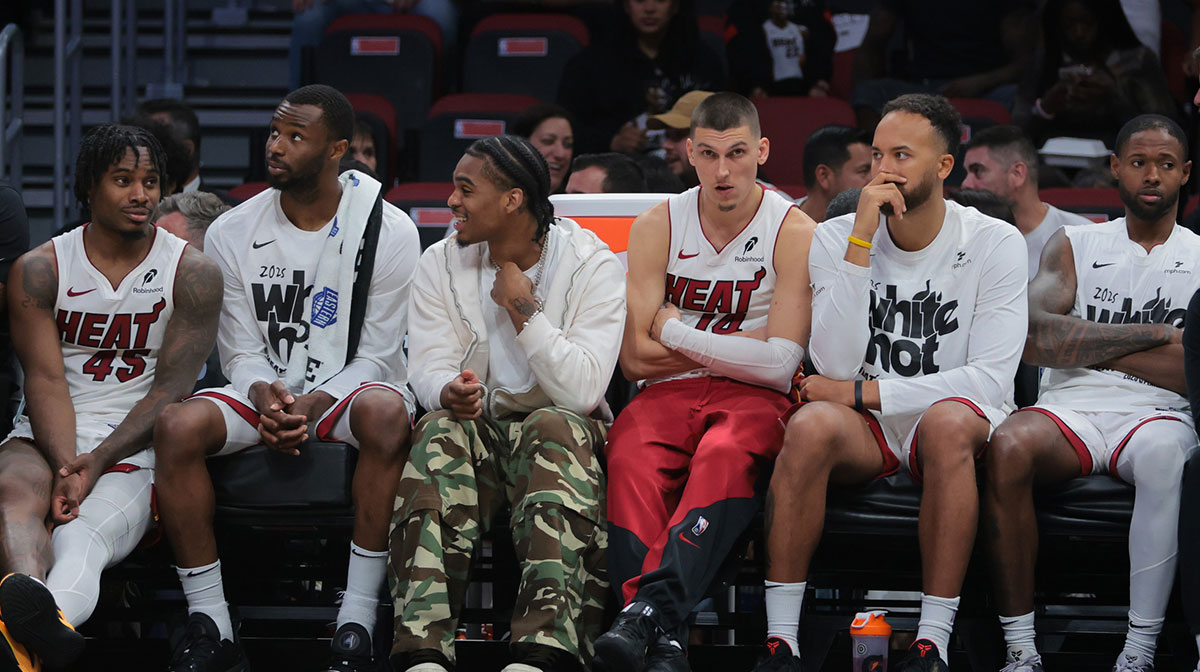 Miami Heat guard Tyler Herro (center) looks on from the bench against the Cleveland Cavaliers in the fourth quarter during game four for the first round of the 2025 NBA Playoffs at Kaseya Center.