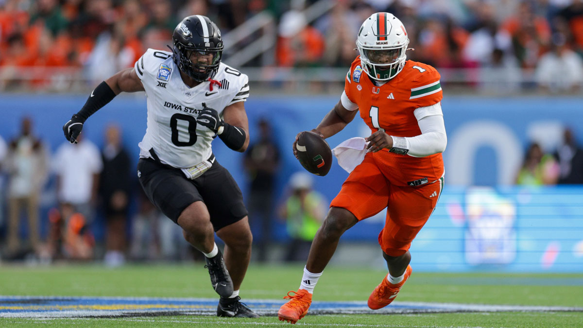 Miami Hurricanes quarterback Cam Ward (1) runs with the ball against the Iowa State Cyclones in the second quarter during the Pop Tarts bowl at Camping World Stadium.