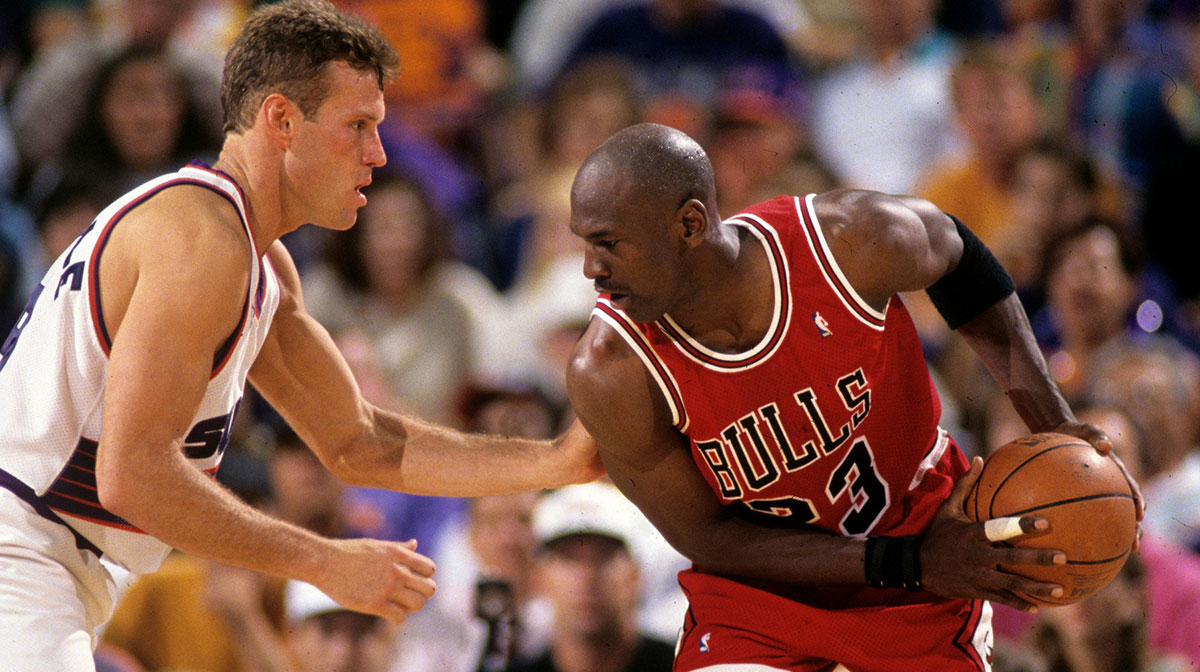 Suns guard Dan Majerle defends Bulls guard Michael Jordan during Game 1 of the NBA Finals in 1993 in Phoenix.