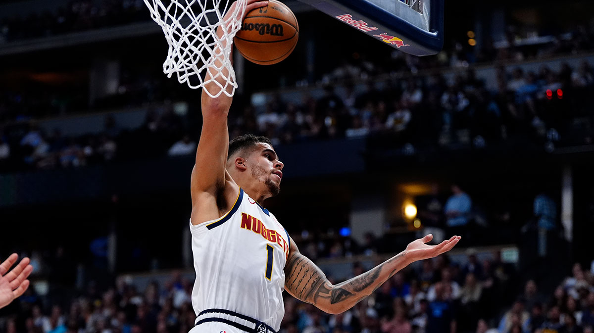 Denver Nuggets forward Michael Porter Jr. (1) pulls in a rebound in the second quarter against the Memphis Grizzlies at Ball Arena.