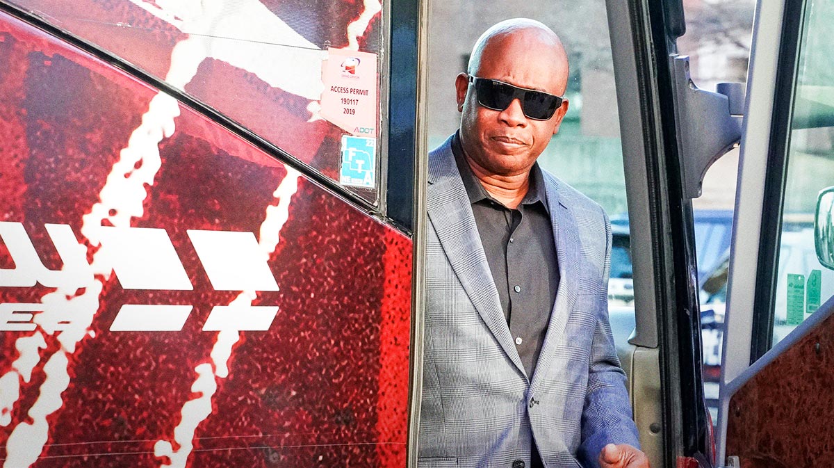 Nebraska Cornhuskers interim head coach Mickey Joseph walks off the bus