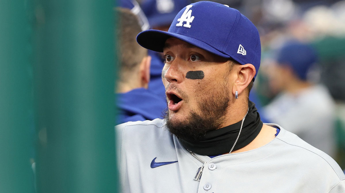 Apr 7, 2025; Washington, District of Columbia, USA;Los Angeles Dodgers shortstop Miguel Rojas (72) talks to teammates in the dugout prior to their game against the Washington Nationals at Nationals Park. Mandatory Credit: Geoff Burke-Imagn Images