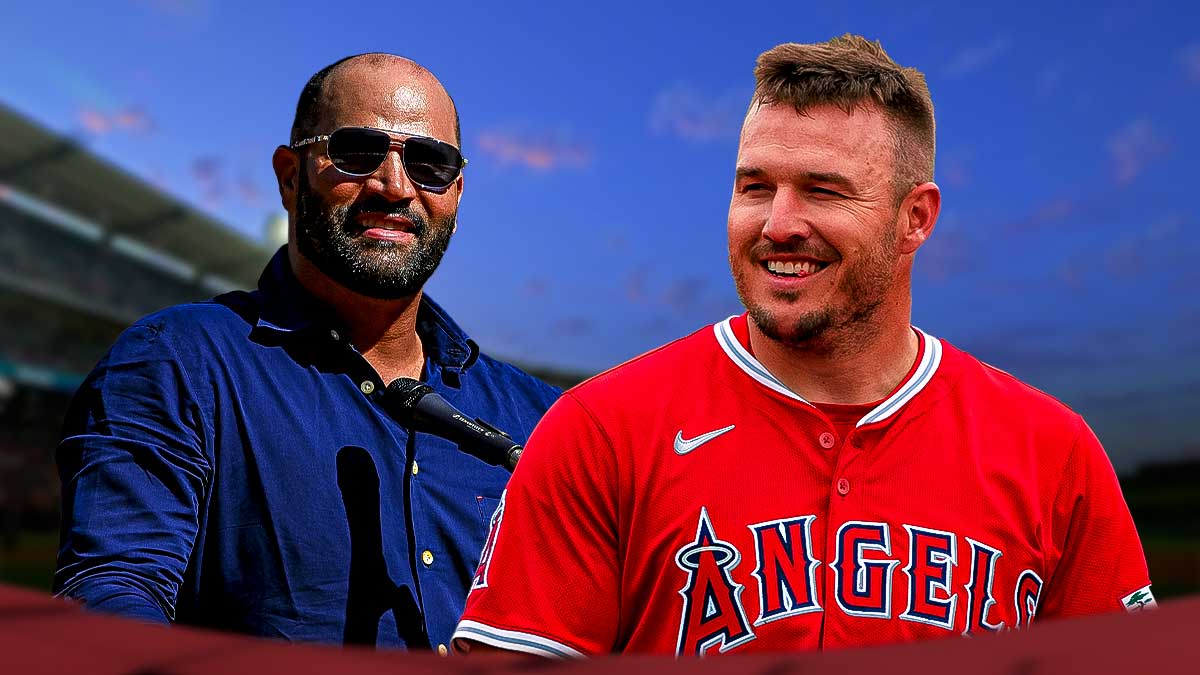 Angels' Mike Trout smiling at Albert Pujols