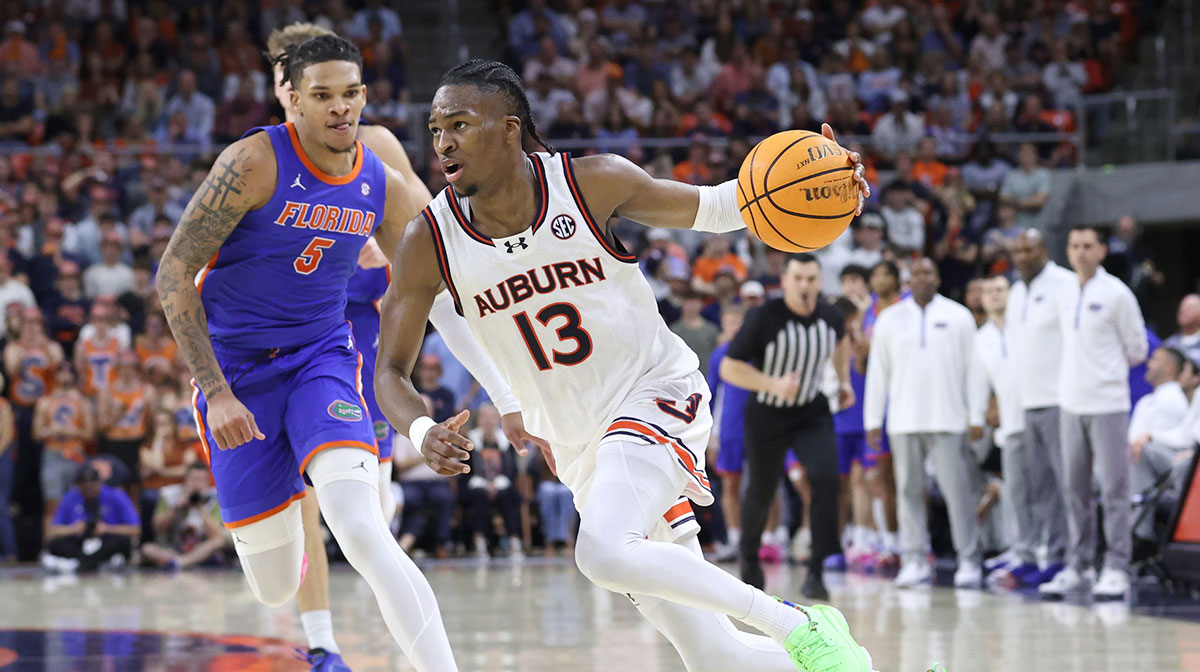 Feb 8, 2025; Auburn, Alabama, USA; Auburn Tigers guard Miles Kelly (13) runs a play against the Florida Gators during the second half at Neville Arena.