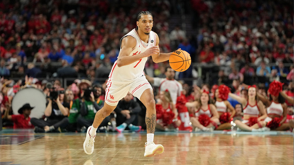 Houston Cougars guard Milos Uzan (7) dribbles the ball against the Florida Gators during the first half of the national championship game of the Final Four of the 2025 NCAA Tournament at the Alamodome.