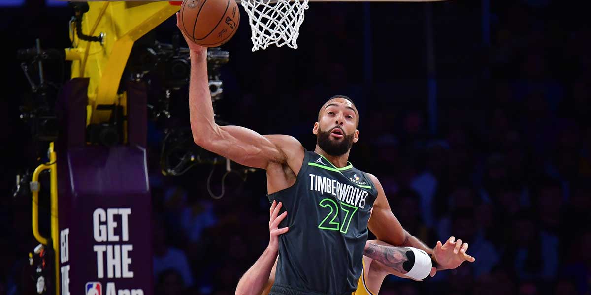 Minnesota Timberwolves center Rudy Gobert (27) gets the ball against Los Angeles Lakers guard Luka Doncic (77) during the first half in game five of first round for the 2025 NBA Playoffs at Crypto.com Arena