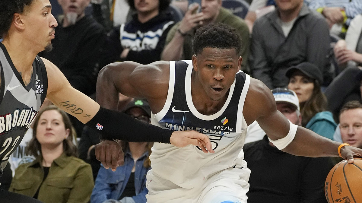 Minnesota Timberwolves guard Anthony Edwards (5) works around Brooklyn Nets forward Jalen Wilson (22) in the third quarter at Target Center.