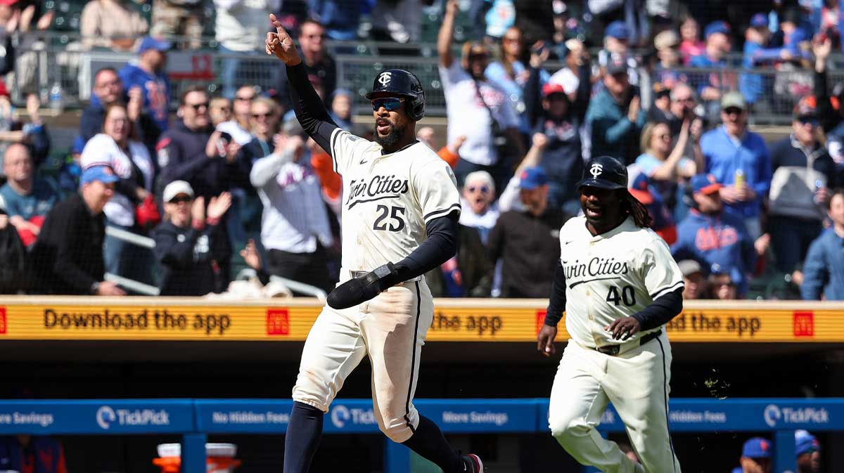Minnesota Twins center fielder Byron Buxton (25) celebrates after scoring the game winning run on a hit by first baseman Ty France (13) during the tenth inning against the New York Mets at Target Field