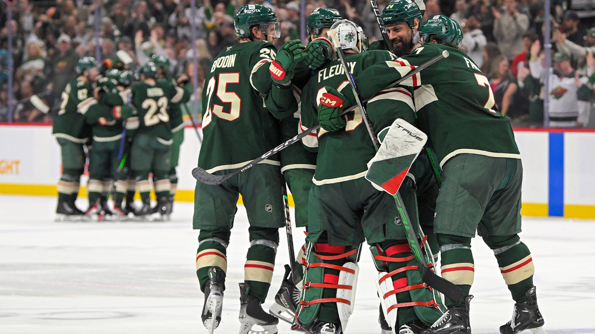 Minnesota Wild goalie Marc-Andre Fleury (29) is congratulated by defenseman Jonas Brodin (25), defenseman Zach Bogosian (24) and defenseman Brock Faber (7) after an overtime victory over the San Jose Sharks at Xcel Energy Center.