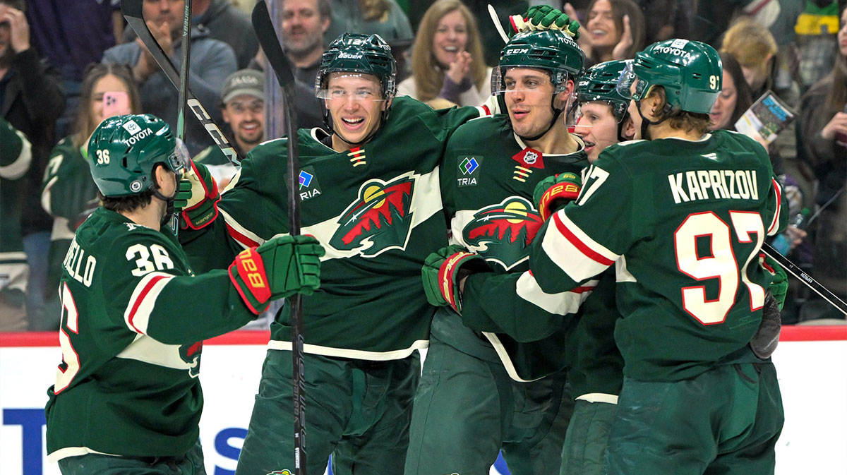 Minnesota Wild forward Joel Eriksson Ek (14) celebrates with forward Mats Zuccarello (36), forward Joel Eriksson Ek (14), forward Marco Rossi (23) and forward Kiril Kaprizov (97) after completing a hat trick on a power play goal against the San Jose Sharks during the third period at Xcel Energy Center.