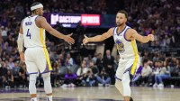Golden State Warriors guard Stephen Curry (30) celebrates with guard Moses Moody (4) during the fourth quarter against the Sacramento Kings at Golden 1 Center.