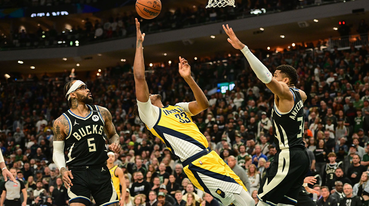 Indiana Pacers center Myles Turner (33) reaches for the ball against Milwaukee Bucks guard Gary Trent Jr. (5) and forward Giannis Antetokounmpo (34) in the first quarter during game four of first round for the 2024 NBA Playoffs at Fiserv Forum
