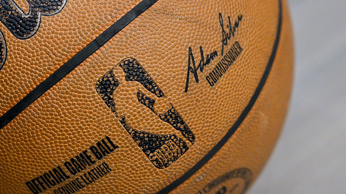 A view of an NBA basketball and the NBA logo before the game between the Dallas Mavericks and the Toronto Raptors at the American Airlines Center.