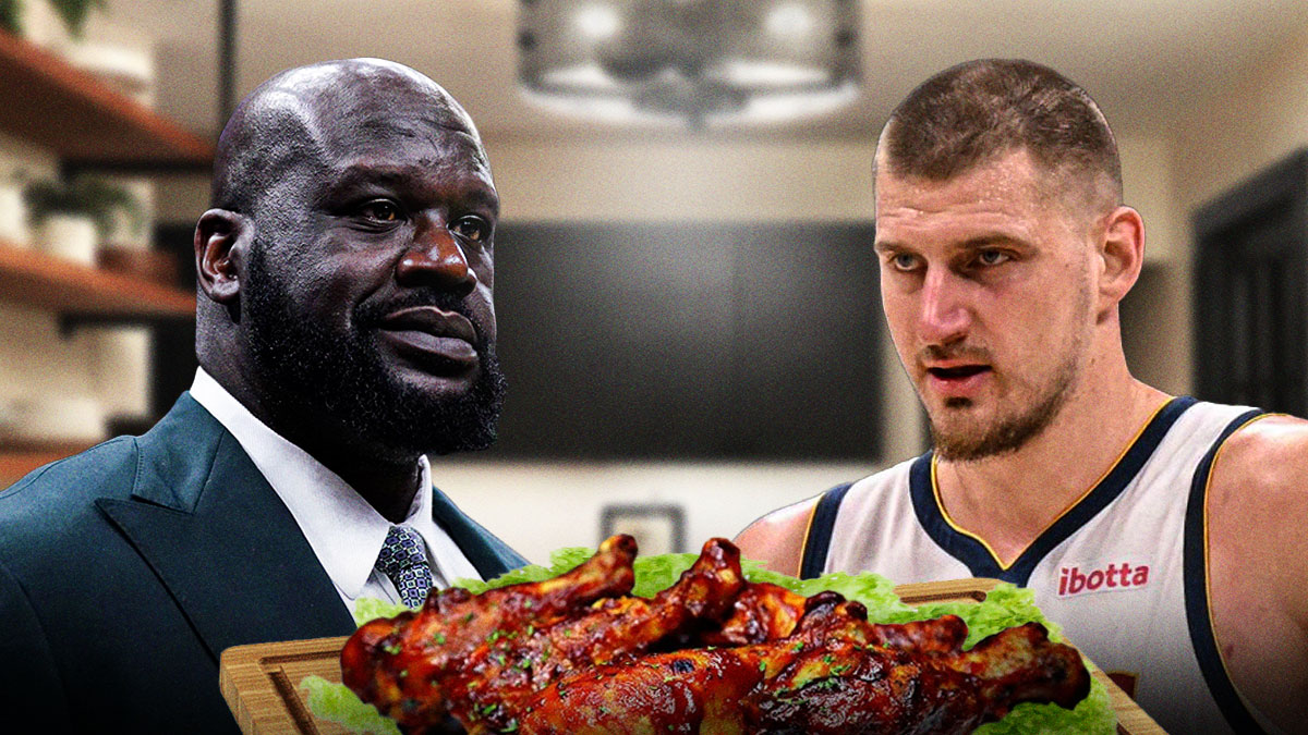 Shaquille O'Neal on the left and Nikola Jokic on the right both looking serious. A plate of cooked BBQ chicken in the middle
