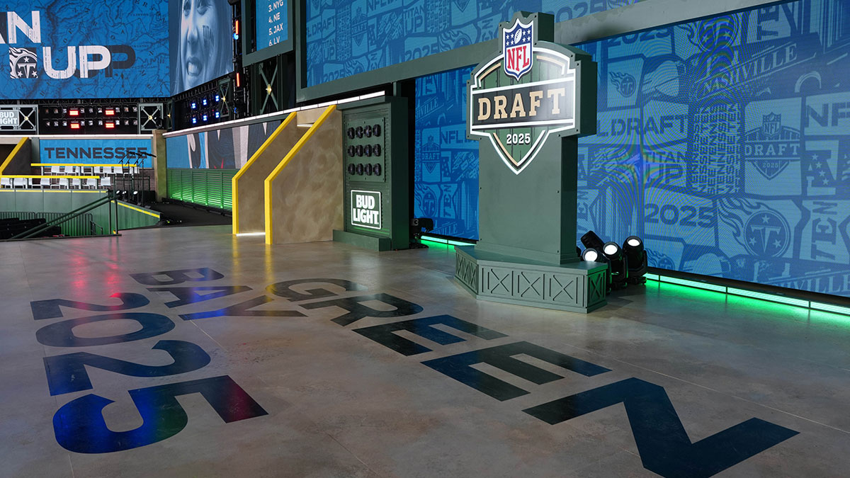 The Green Bay 2025 logo on the main stage before the NFL Draft at Lambeau Field.