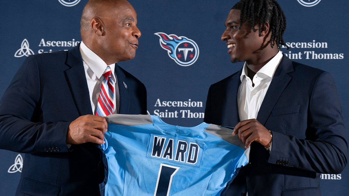 NFL Hall of Fame quarterback Warren Moon, left, poses for pictures with Cam Ward who earlier had been introduced as the Tennessee Titans first-round pick – and overall number one pick – in the NFL Draft at Ascension Saint Thomas Sports Park in Nashville, Tenn., Friday, April 25, 2025. Moon, whose No. 1 jersey is retired for the Tennessee Titans, allowed Ward to wear his number.