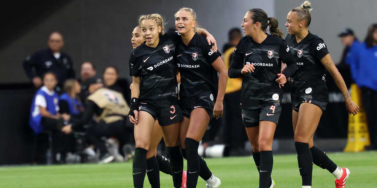 Angel City FC forward Riley Tiernan (33, center) celebrates with defender Savy King (3) after scoring a goal during the second half against the Seattle Reign FC at BMO Stadium. Mandatory Credit: Kiyoshi Mio-Imagn ImagesMar 30, 2025; Los Angeles, California, USA; Angel City FC forward Riley Tiernan (33, center) celebrates with defender Savy King (3) after scoring a goal during the second half against the Seattle Reign FC.