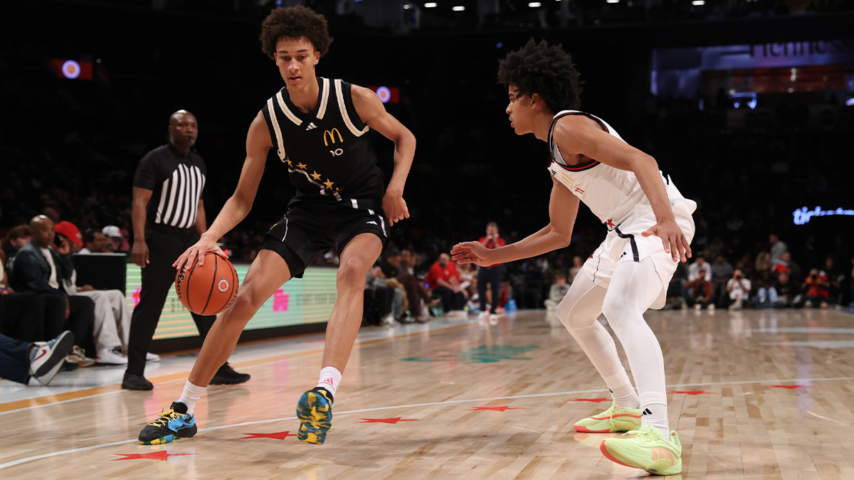 McDonald's All American East forward Nate Ament (10) dribbles the ball against McDonald's All American West guard Mikel Brown Jr. (11) during the second half of the game at Barclays Center.