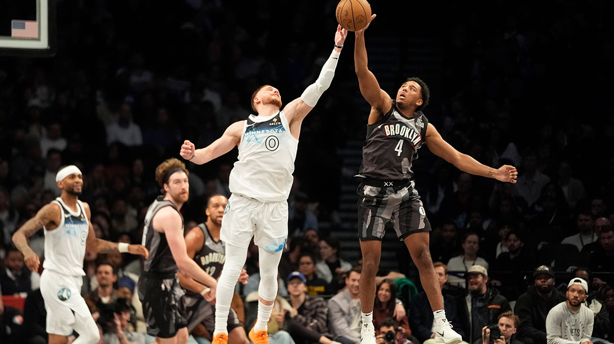 Minnesota Timberwolves shooting guard Donte DiVincenzo (0) and Brooklyn Nets guard Reece Beekman (4) battle for a loose ball during the second half at Barclays Center.