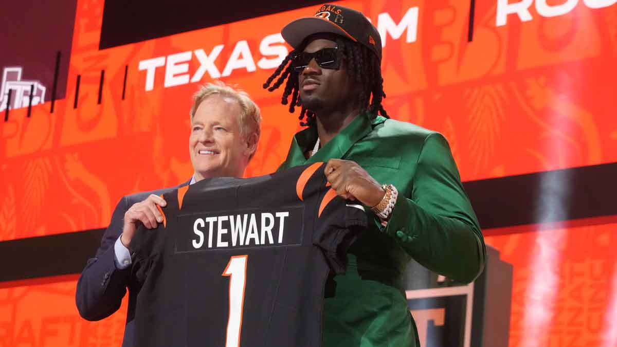 NFL commissioner Roger Goodell with Texas A&M Aggies defensive end Shemar Stewart after her is selected by the Cincinnati Bengals as the number seventeen pick in the first round of the 2025 NFL Draft at Lambeau Field.