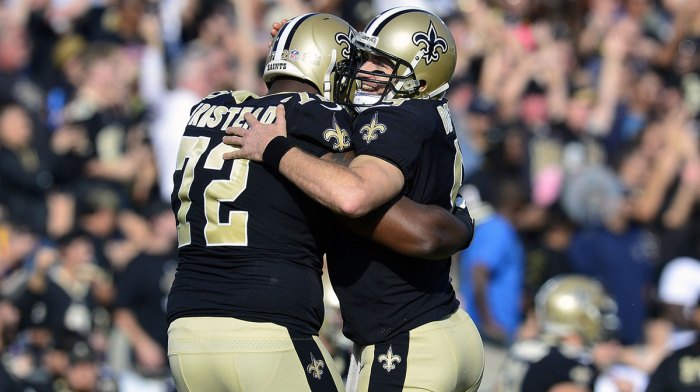 New Orleans Saints quarterback Drew Brees (9) celebrates with offensive tackle Terron Armstead (72) after running back Alvin Kamara (41) scores a touchdown against the Los Angeles Rams during the first half at the Los Angeles Memorial Coliseum.