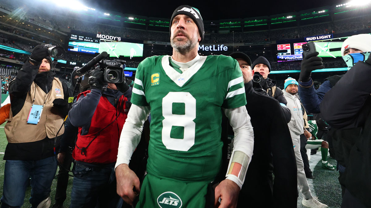 New York Jets quarterback Aaron Rodgers (8) walks on the field after the Jets win over the Miami Dolphins at MetLife Stadium
