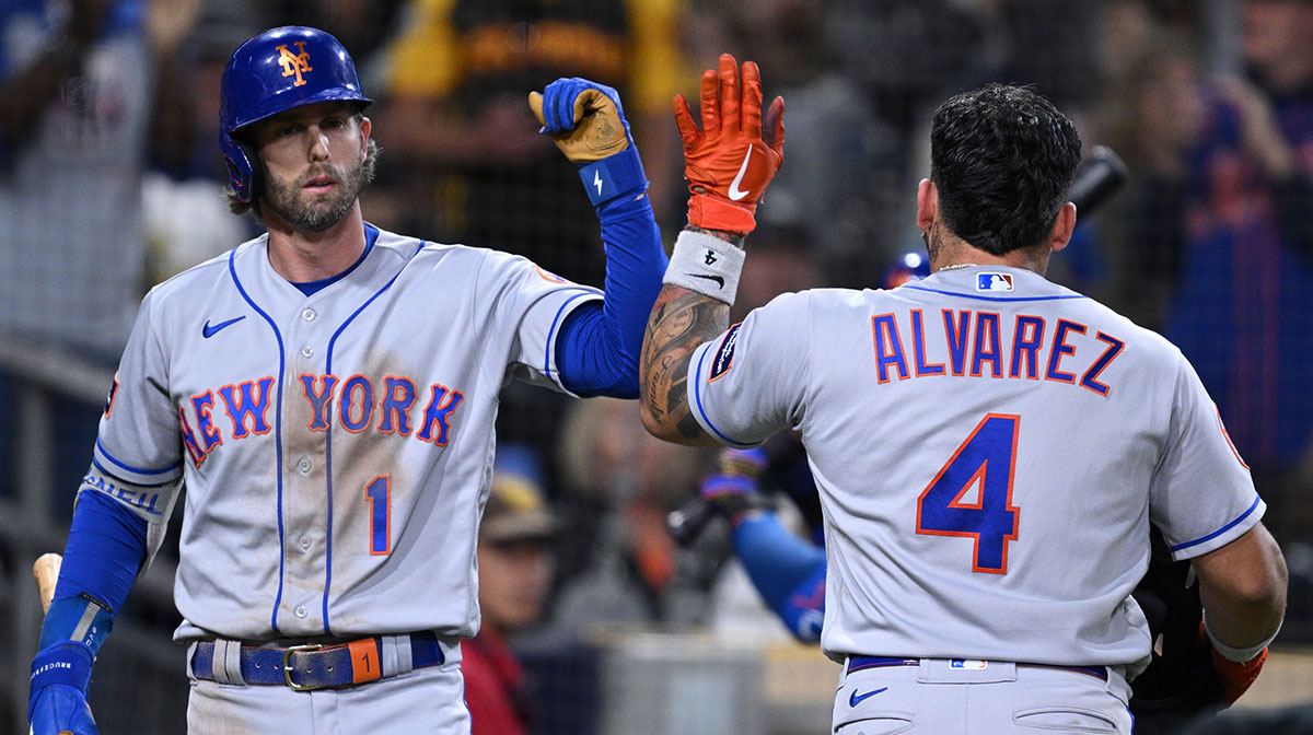 New York Mets catcher Francisco Alvarez (4) is congratulated by second baseman Jeff McNeil (1) after hitting a home run against the San Diego Padres during the seventh inning at Petco Park.
