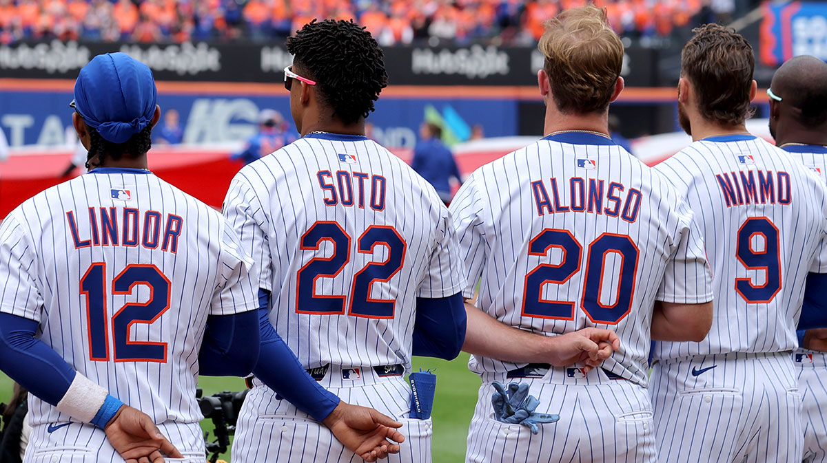 New York Mets shortstop Francisco Lindor (12) and right fielder Juan Soto (22) and first baseman Pete Alonso (20) and left fielder Brandon Nimmo (9) stand for the national anthem before the Mets home opener against the Toronto Blue Jays at Citi Field.