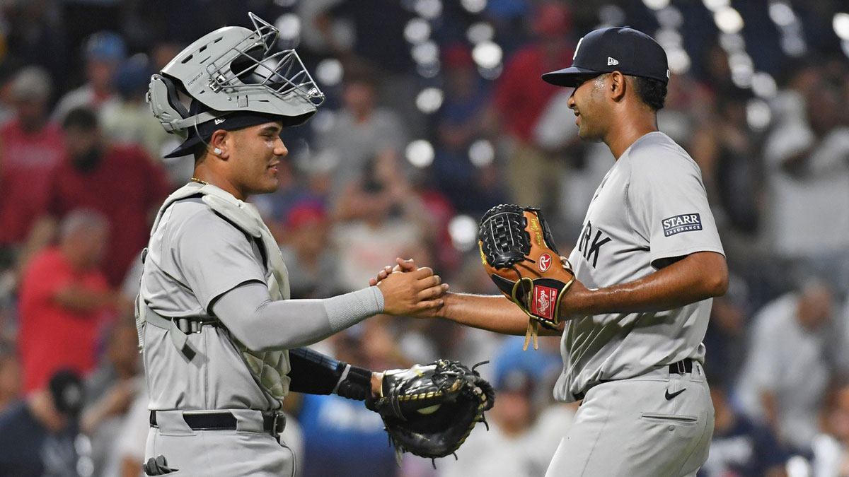 Jul 29, 2024; Philadelphia, Pennsylvania, USA; New York Yankees catcher Carlos Narvaez (94) and pitcher Yoendrys Gómez (92) celebrate win against the Philadelphia Phillies at Citizens Bank Park. Mandatory Credit: Eric Hartline-Imagn Images