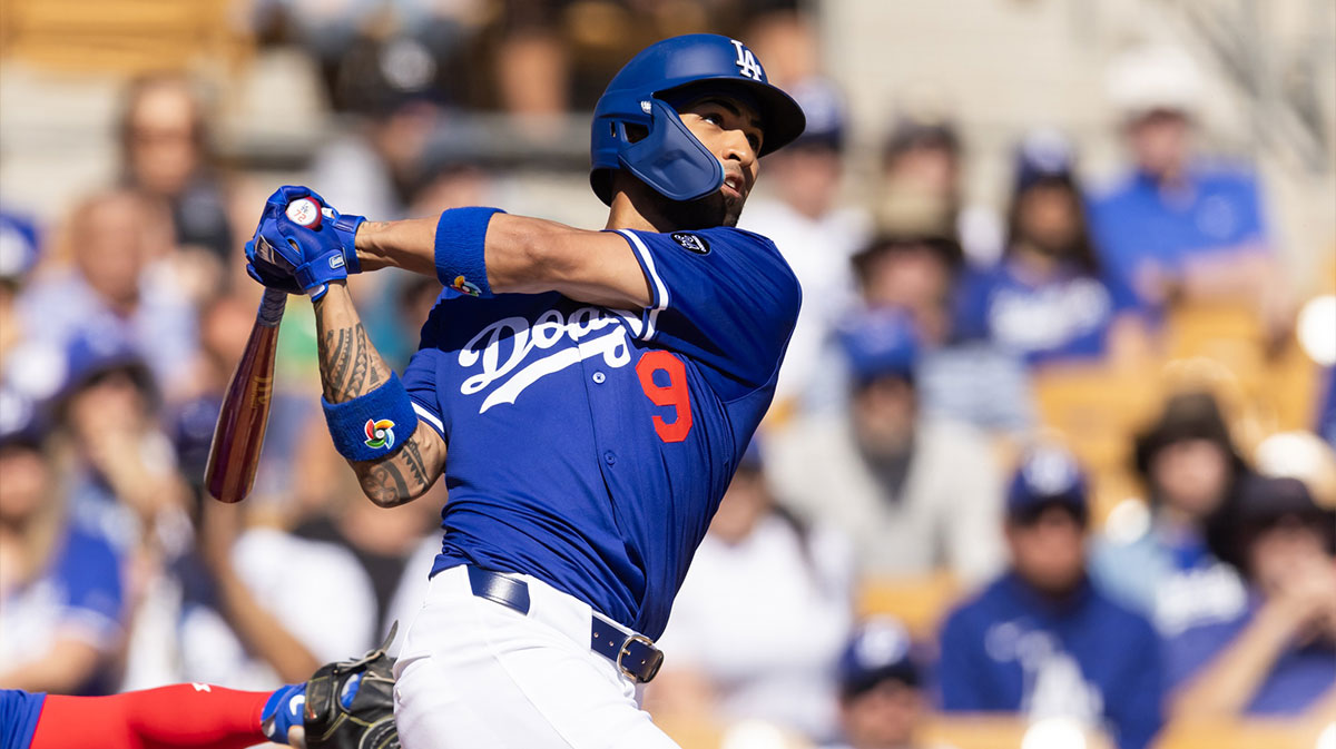 Los Angeles Dodgers outfielder Eddie Rosario hits a two run home run against the Chicago Cubs during a spring training game at Camelback Ranch-Glendale.