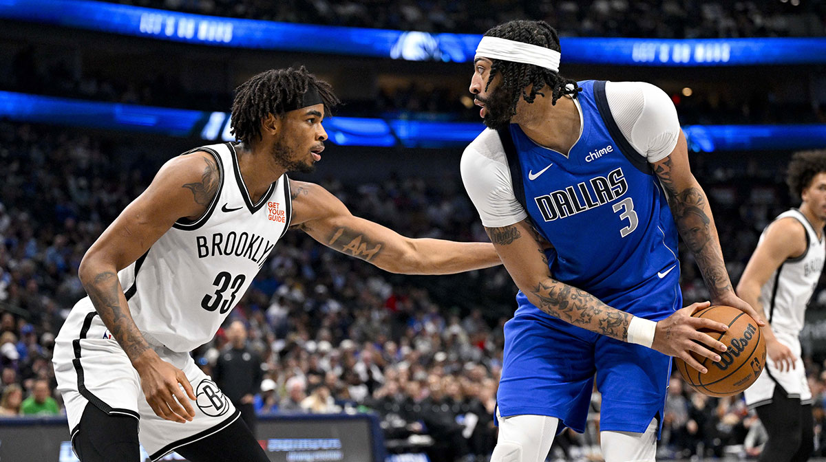 Dallas Mavericks forward Anthony Davis (3) looks to move the ball past Brooklyn Nets center Nic Claxton (33) during the second quarter at the American Airlines Center.