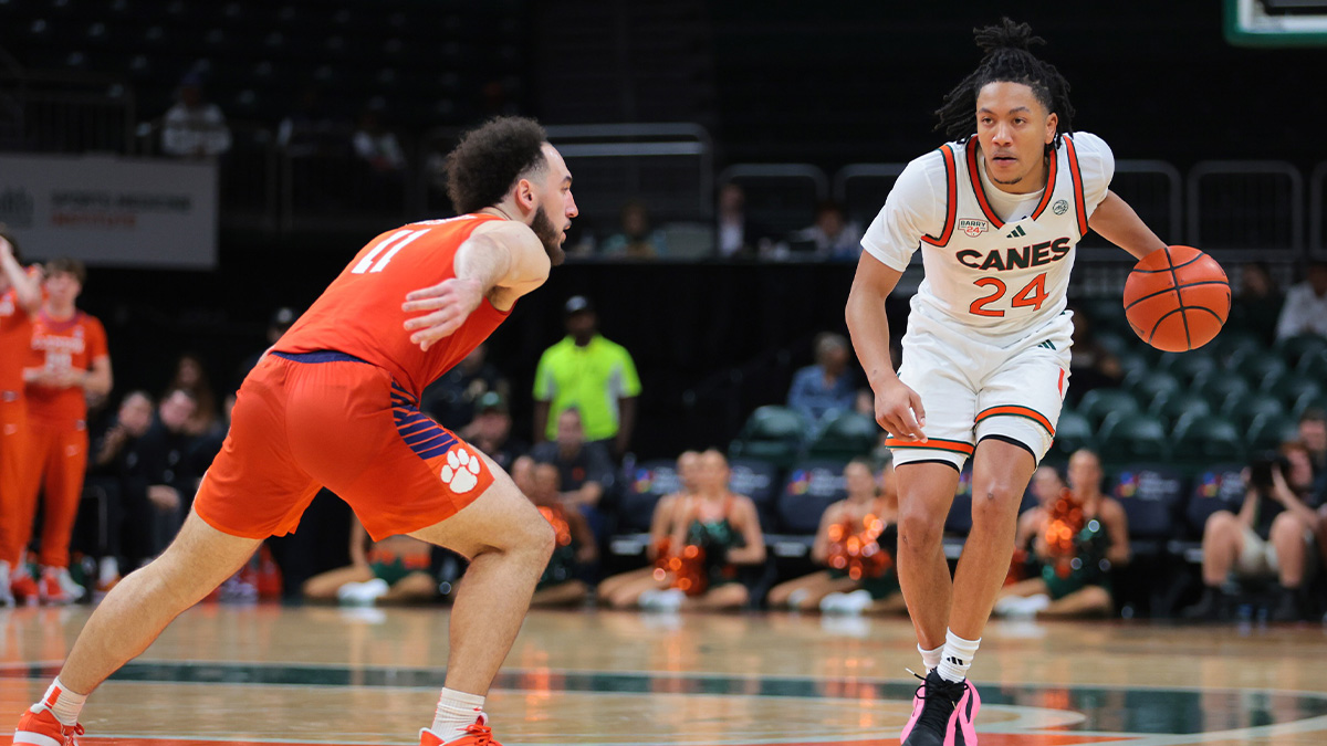 Miami Hurricanes guard Nijel Pack (24) dribbles the basketball as Clemson Tigers guard Jaeden Zackery (11) defends during the second half at Watsco Center.
