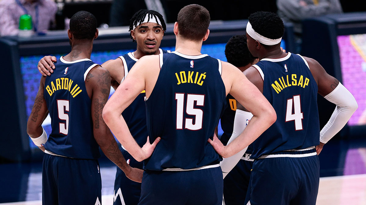 Denver Nuggets guard Gary Harris (14) with forward Will Barton (5) and center Nikola Jokic (15) and forward Paul Millsap (4) and guard PJ Dozier (35) during a timeout in the fourth quarter against the Sacramento Kings at Ball Arena.