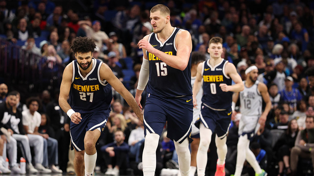 Denver Nuggets guard Jamal Murray (27) celebrates with center Nikola Jokic (15) after a basket against the Orlando Magic in the third quarter at Kia Center.