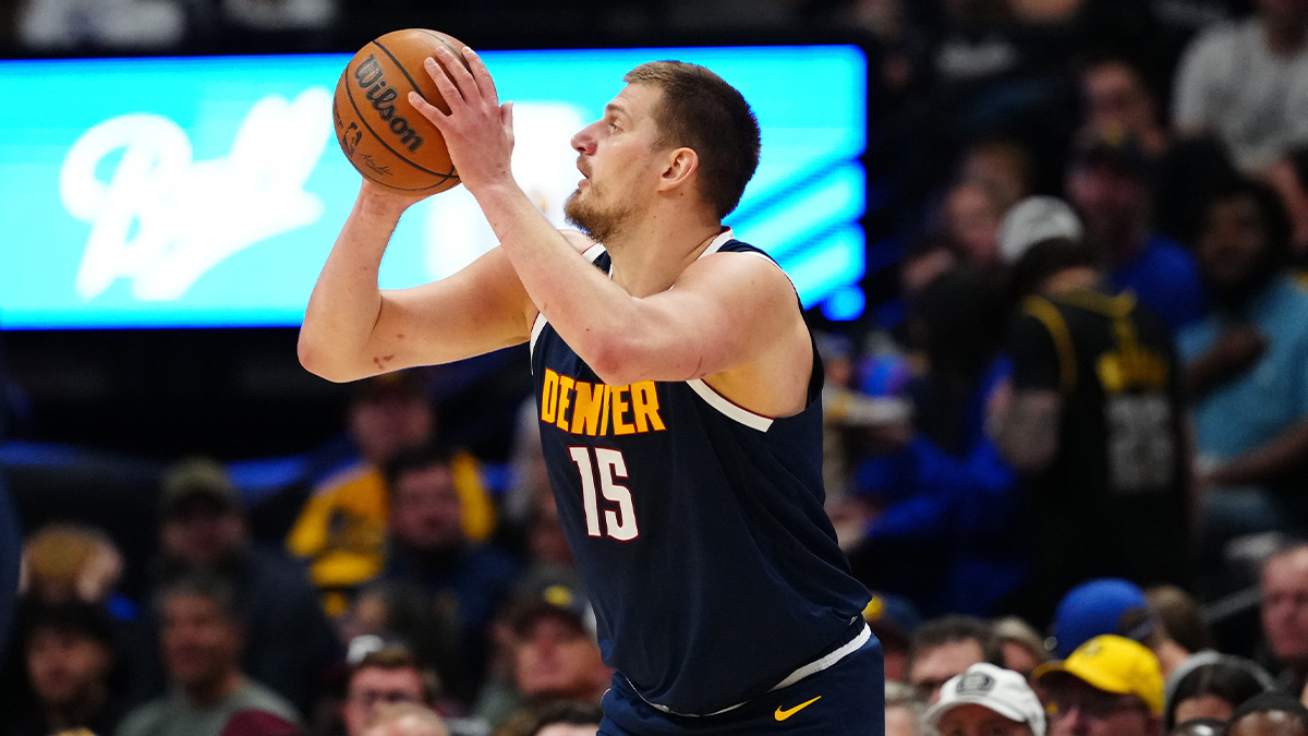 Denver Nuggets center Nikola Jokic (15) prepares to shoot the ball in the first quarter against the Indiana Pacers at Ball Arena.