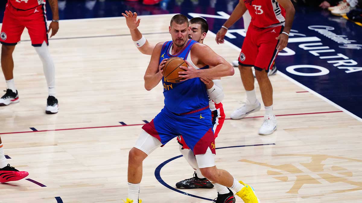 LA Clippers center Ivica Zubac (40) defends on Denver Nuggets center Nikola Jokic (15) in the first quarter at Ball Arena.