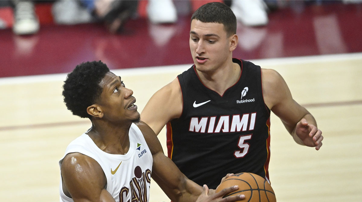 Cleveland Cavaliers forward De'Andre Hunter (12) looks to the basket beside Miami Heat forward Nikola Jovic (5) in the fourth quarter of game two of the first round of the 2025 NBA Playoffs at Rocket Arena.