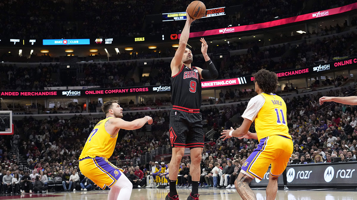 Chicago Bulls center Nikola Vucevic (9) shoots over Los Angeles Lakers center Jaxson Hayes (11) during the first quarter at United Center.