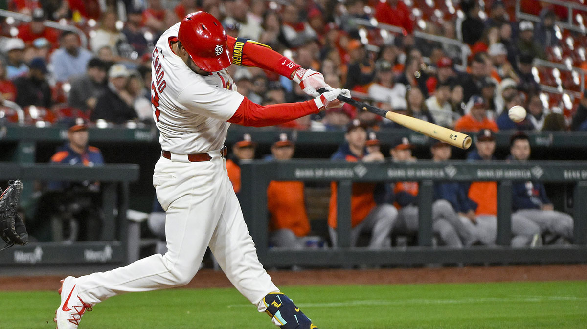 St. Louis Cardinals third baseman Nolan Arenado (28) hits a one run double against the Houston Astros during the fifth inning at Busch Stadium