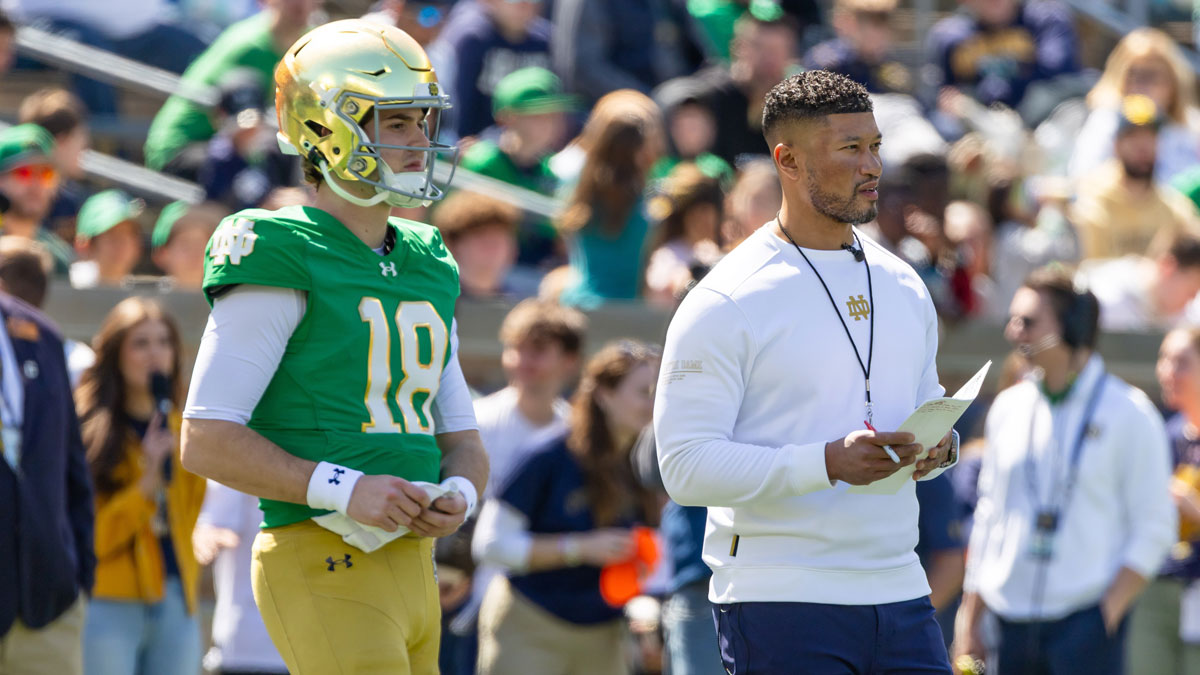 Notre Dame Fighting Irish quarterback Steve Angeli (18) watches alongside head coach Marcus Freeman during the Blue-Gold game at Notre Dame Stadium.
