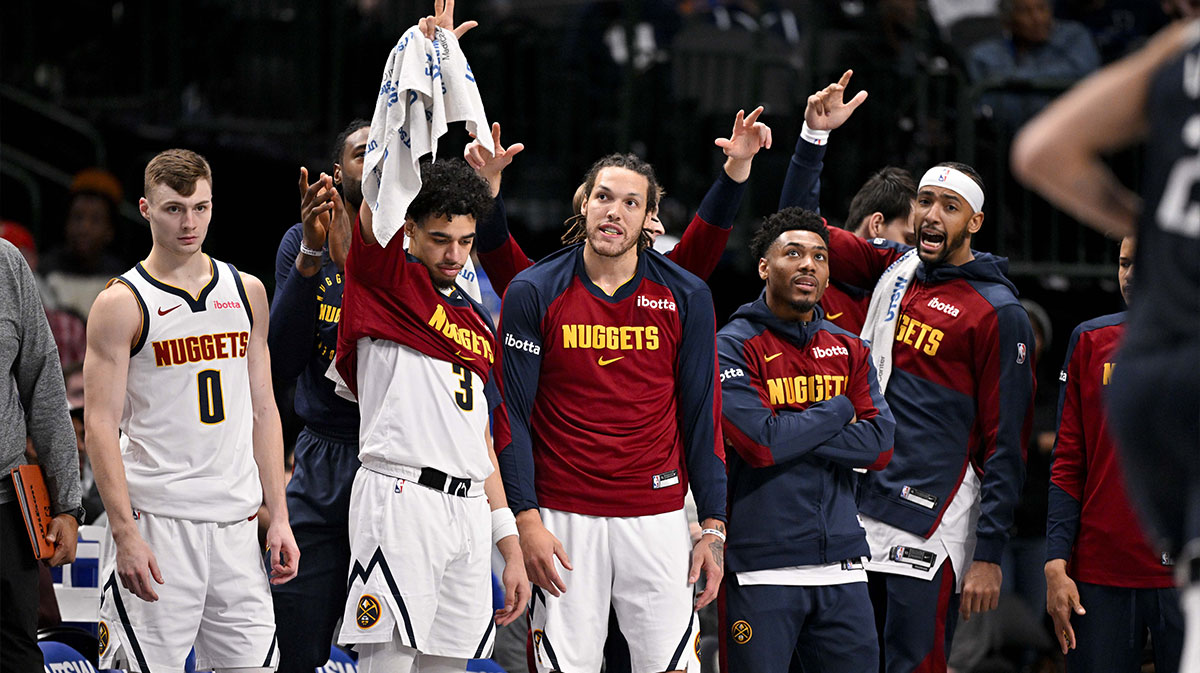 The Denver Nuggets team bench celebrates during the second half of the game against the Dallas Mavericks at the American Airlines Center.