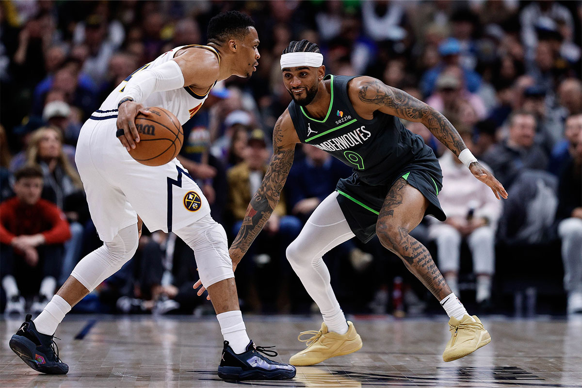 Denver Nuggets guard Russell Westbrook (4) controls the ball as Minnesota Timberwolves guard Nickeil Alexander-Walker (9) guards in the second quarter at Ball Arena.