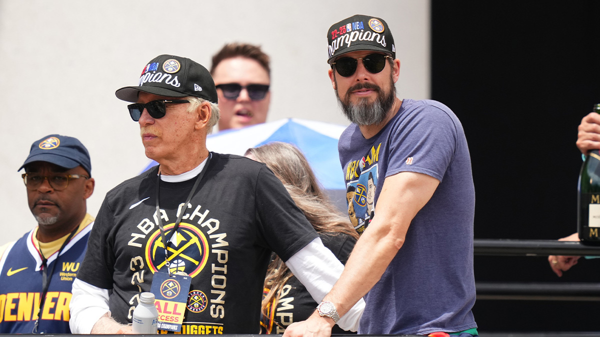 Nuggets president Josh Kroenke next to Michael Porter Jr. addressing his trade rumors