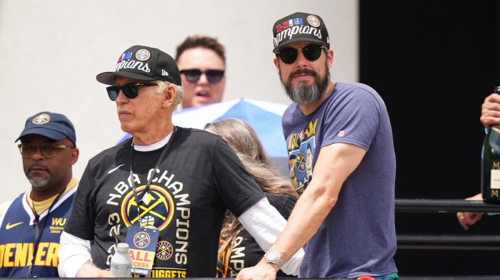 Nuggets president Josh Kroenke next to Michael Porter Jr. addressing his trade rumors