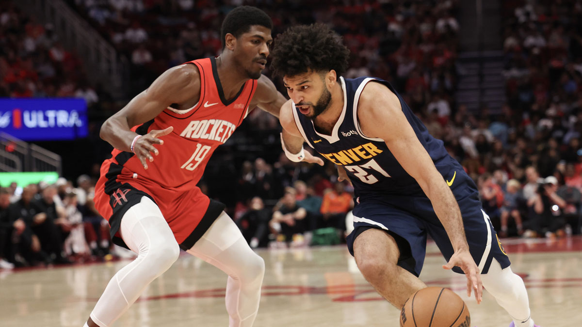 Denver Nuggets guard Jamal Murray (27) dribbles against Houston Rockets guard Nate Williams (19) in the second half at Toyota Center.