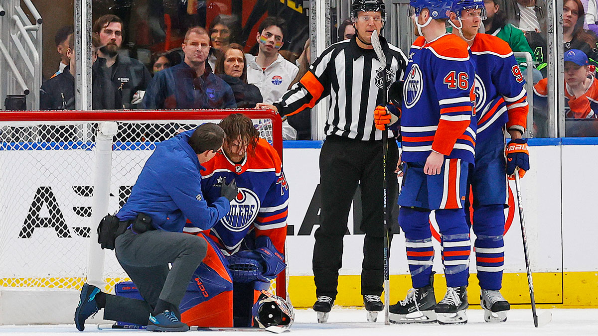 Edmonton Oilers goaltender Stuart Skinner (74) is tended to by medical staff after being hit in the head with a knee from Dallas Stars forward forward Mikko Rantanen (96) during the third period at Rogers Place.