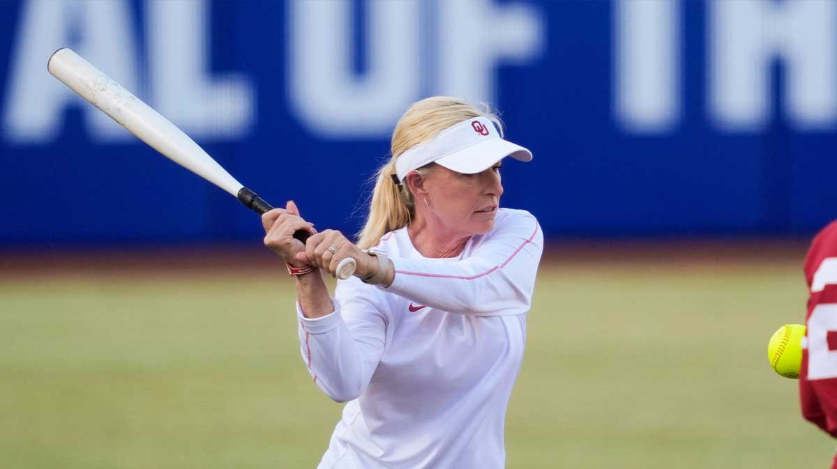 Oklahoma coach Patty Gasso runs drills with her team before a college Bedlam softball game between the University of Oklahoma Sooners (OU) and the Oklahoma State University Cowgirls (OSU) at Devon Park in Oklahoma City