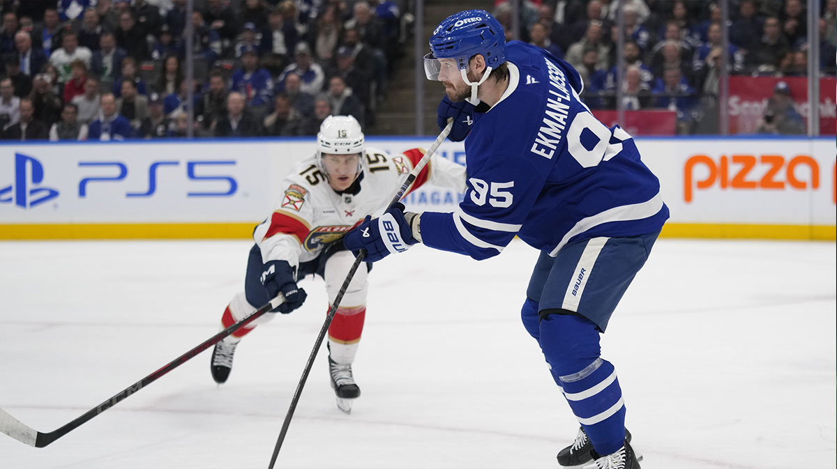 Toronto Maple Leafs defenceman Oliver Ekman-Larsson (95) clears the puck as Florida Panthers forward Anton Lundell (15) closes in during the second period at Scotiabank Arena.